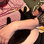 Boris joined the competition — help win amazing prizes! animal, arms, black_cat, casual_clothing, close_up, comfort, cuddle, feline, human, indoor, kitten, nap, person, pet, relaxation, resting, sleeping, soft_fur, striped_shirt, watch
