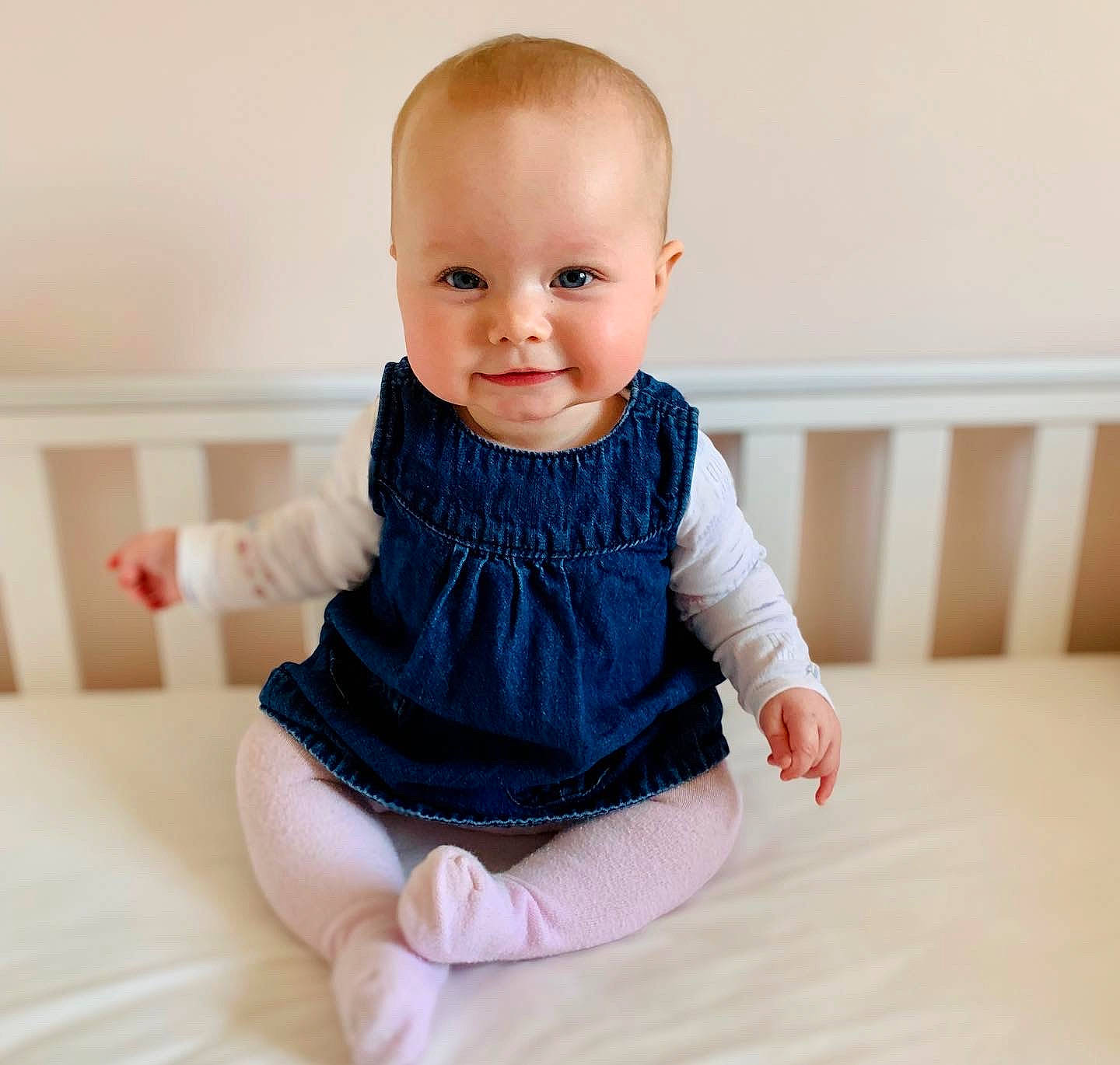 Lila joined the competition — help win amazing prizes! baby, baby_toddler_clothing, cheek, dress, eye, face, finger, gesture, hand, happy, human_body, iris, joint, leg, neck, person, product, shoulder, skin, sleeve