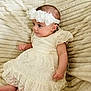 Héloïse participe au concours pour gagner de l'argent avec cette photo : baby, blanket, child, cute, dress, flower, foot, hand, happy, headband, indoors, infant, lace, person, portrait, sitting, skin, small, soft_texture, young