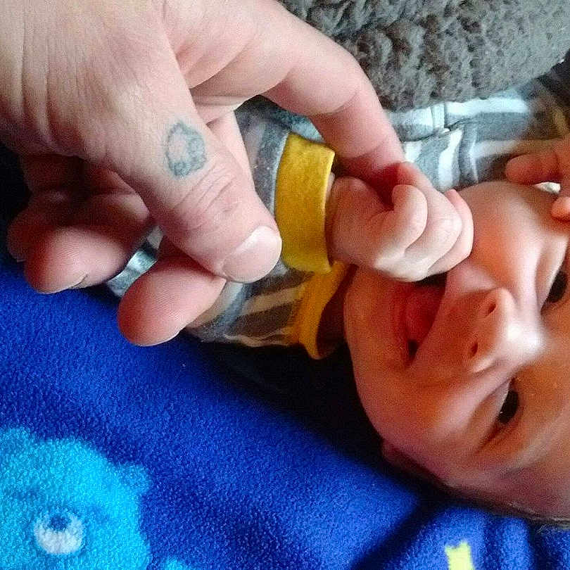 Xander is registered to the contest to win money with this photo: child, ear, finger, hand, infant, mouth, nail, toddler