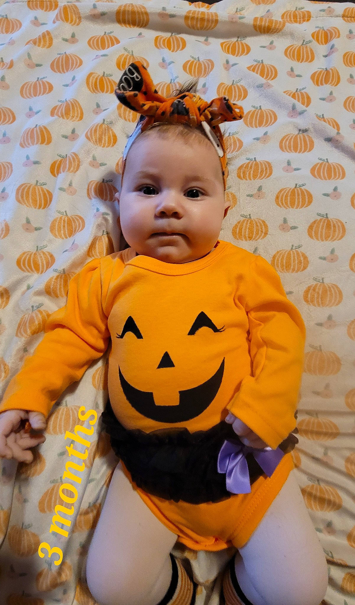Annalise joined the competition — help win amazing prizes! baby, baby_toddler_clothing, calabaza, child, costume, facial_expression, flooring, fun, hairstyle, happy, head, orange, pattern, peach, person, plant, pumpkin, sleeve, smile, toddler