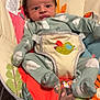 Heath is registered to the contest to win money with this photo: baby, bed, blanket, clothing, coat, cushion, face, furniture, head, homedecor, jacket, machine, newborn, person, photography, portrait, sleeping, transportation, vehicle, wheel