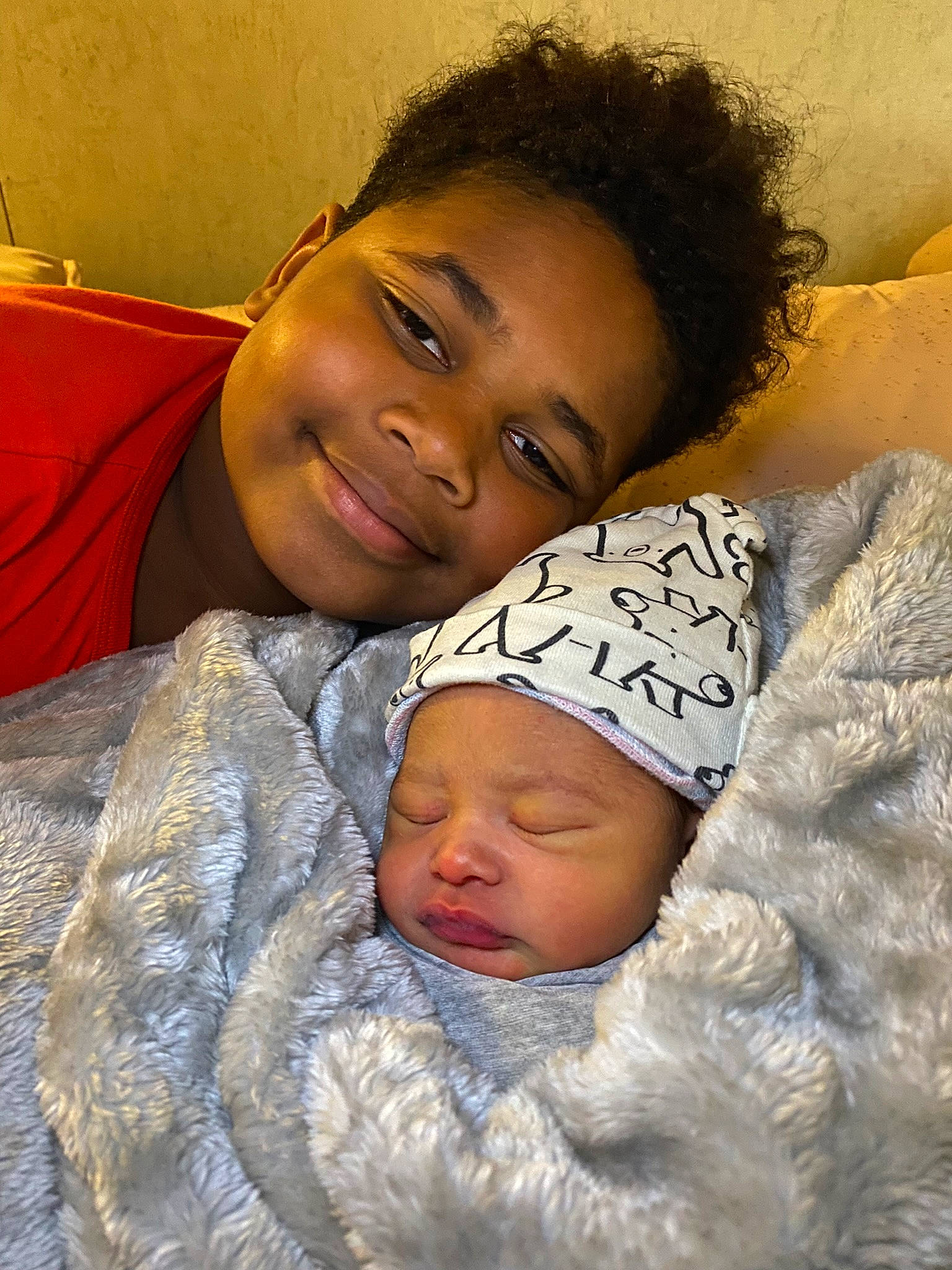 Jordan is registered to the contest to win money with this photo: baby, cheek, child, comfort, eye, eyebrow, face, facial_expression, happy, head, headwear, human, iris, joy, lip, mouth, nose, organ, person, skin