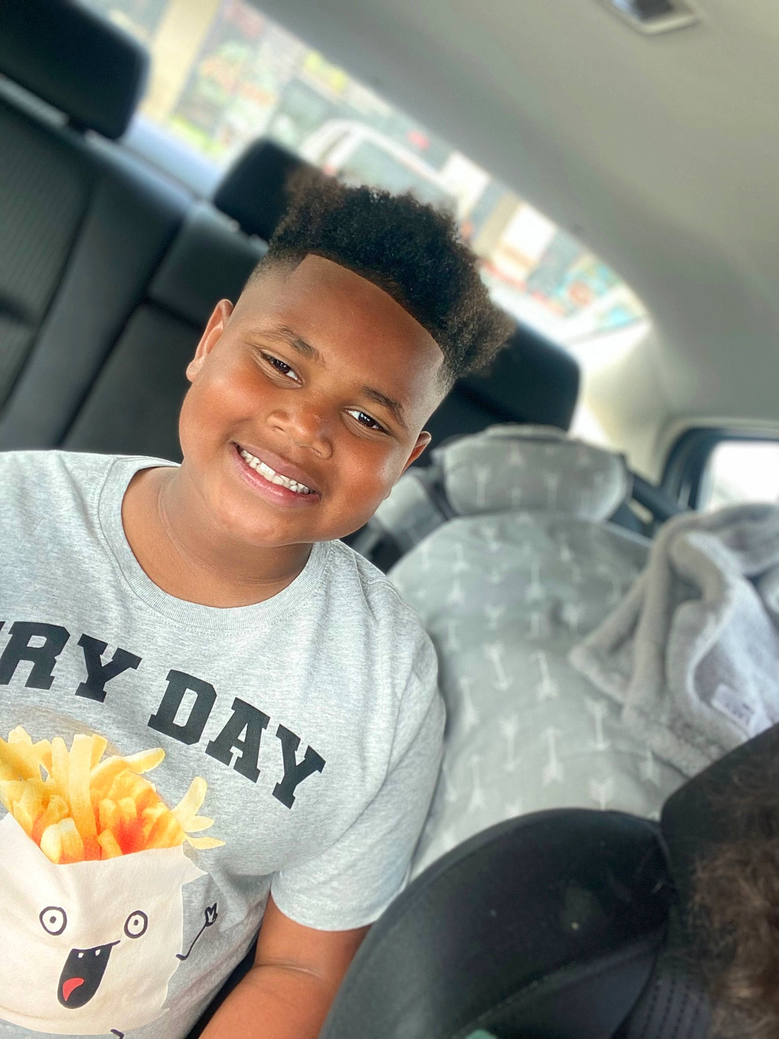 Jordan is registered to the contest to win money with this photo: air_travel, automotive_design, black_hair, car_seat, eye, family_car, flash_photography, forehead, fun, happy, hat, head_restraint, joy, leisure, logo, luxury_vehicle, muscle, person, plant, selfie