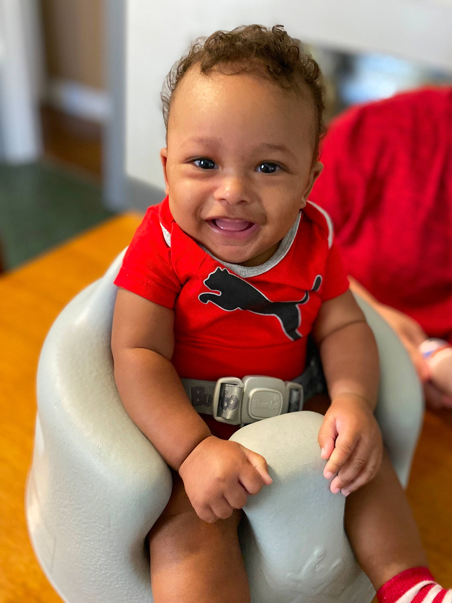 Jayden joined the competition — help win amazing prizes! arm, baby, baby_toddler_clothing, cheek, comfort, face, finger, flooring, fun, happy, head, human_leg, joy, knee, leisure, person, sitting, skin, sleeve, smile