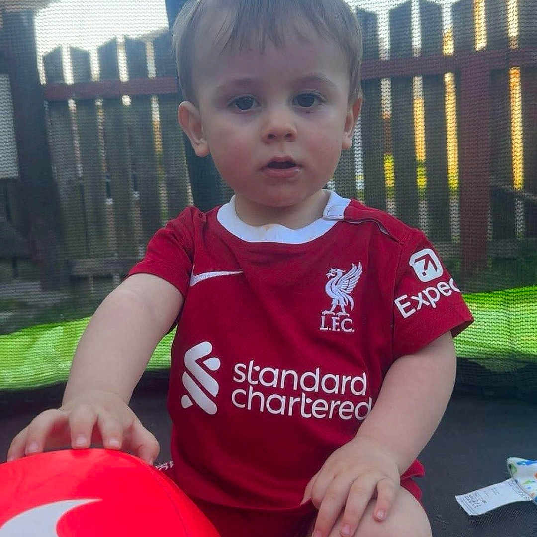 Sonnie joined the competition — help win amazing prizes! backyard, ball, boy, child, clothing, face, fence, football, head, male, nature, outdoors, person, photography, portrait, soccer, soccerball, sport, t_shirt, yard