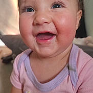 Melody is registered to the contest to win money with this photo: baby, child, smile, happy, onesie, unicorn, rainbow, indoor, portrait, cute, face, infant, eyelashes, pink_clothing, magic, closeup, soft_light, rosy_cheeks, person, young_child