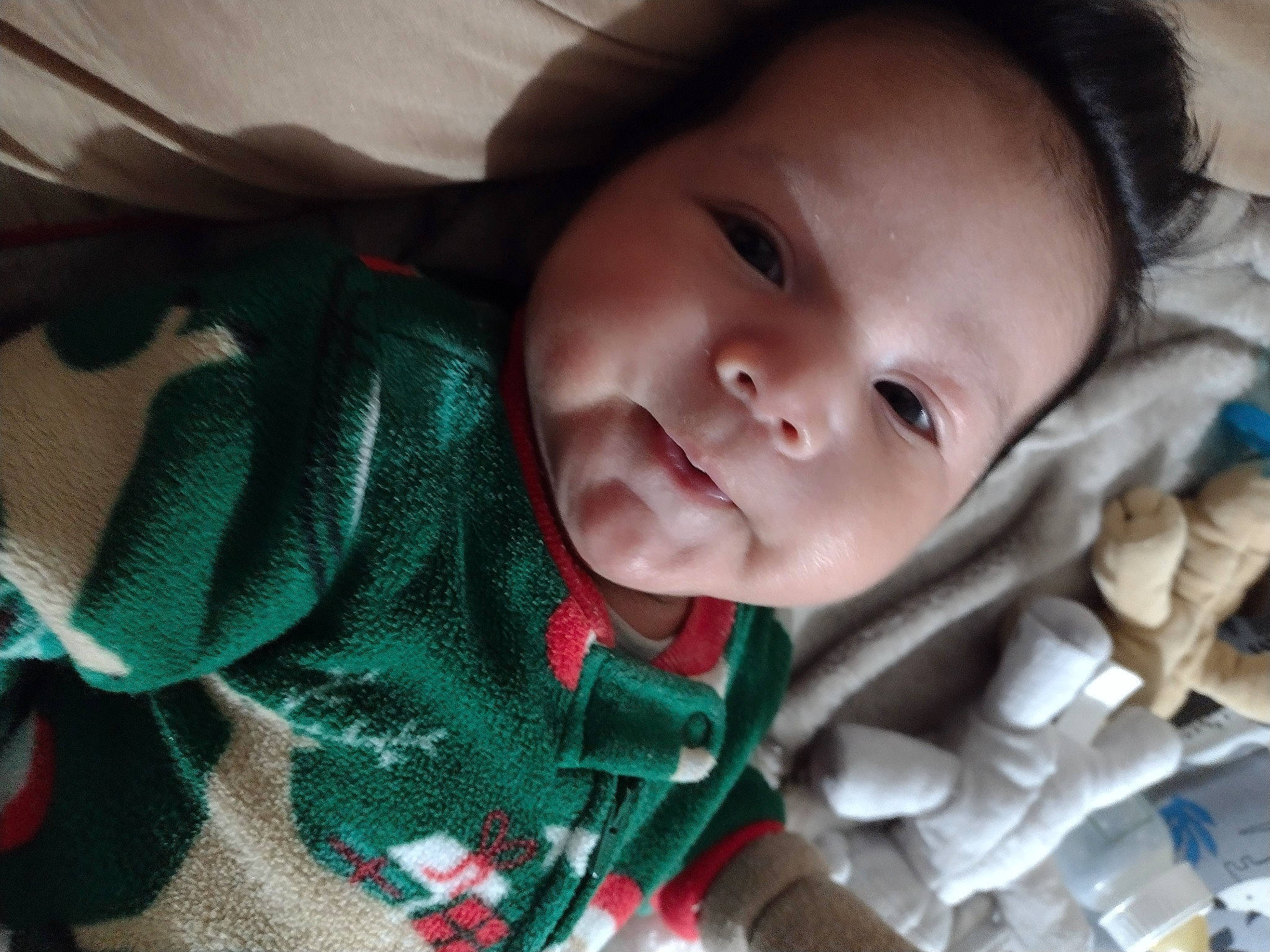 Jesus is registered to the contest to win money with this photo: baby, baby_toddler_clothing, cheek, child, chin, comfort, eyebrow, eyelash, grass, happy, iris, linens, lip, mouth, nose, outerwear, person, skin, sleeve, smile