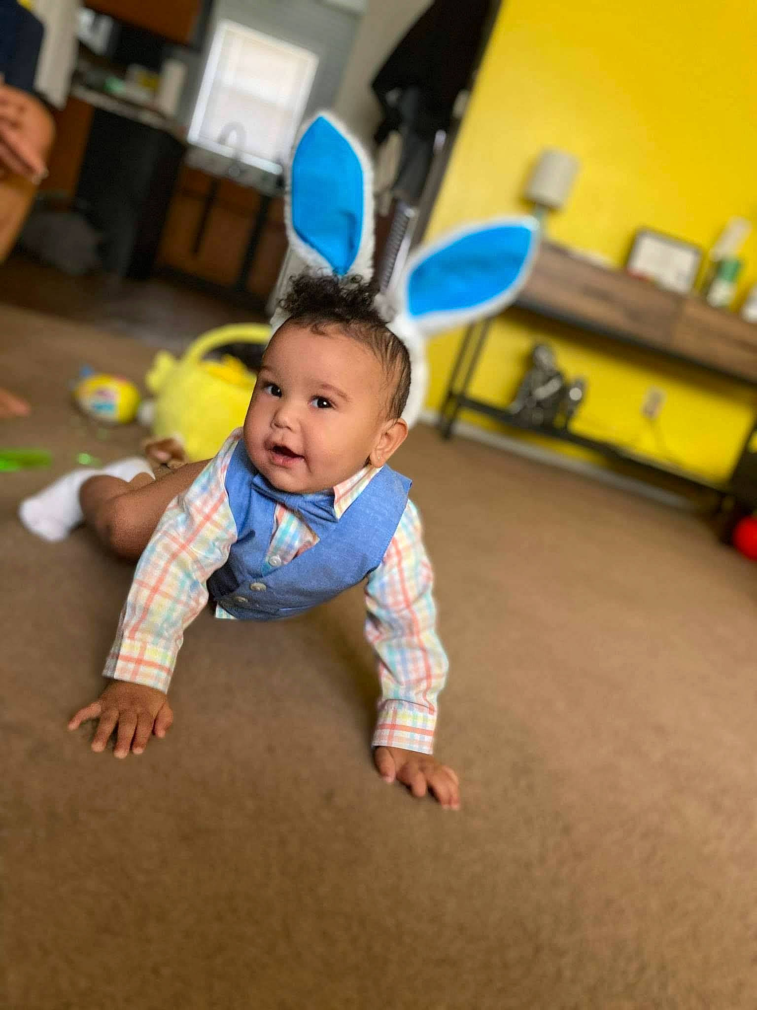 James is registered to the contest to win money with this photo: baby, baby_toddler_clothing, balance, child, crawling, floor, flooring, foot, fun, happy, hardwood, leisure, person, play, room, sitting, sleeve, sock, t_shirt, toddler