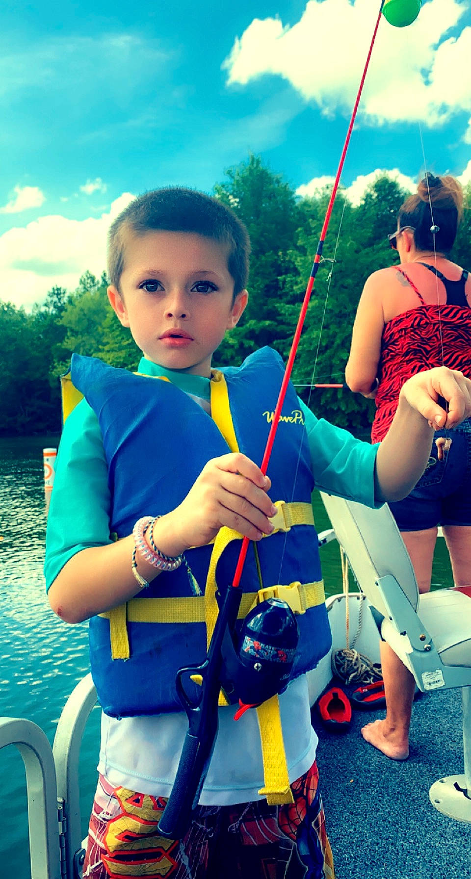 Gannon joined the competition — help win amazing prizes! azure, blue, boats_and_boating_equipment_and_supplies, child, cloud, cool, electric_blue, facial_expression, fun, hairstyle, happy, lake, leisure, people_in_nature, person, recreation, shoulder, skin, sky, travel