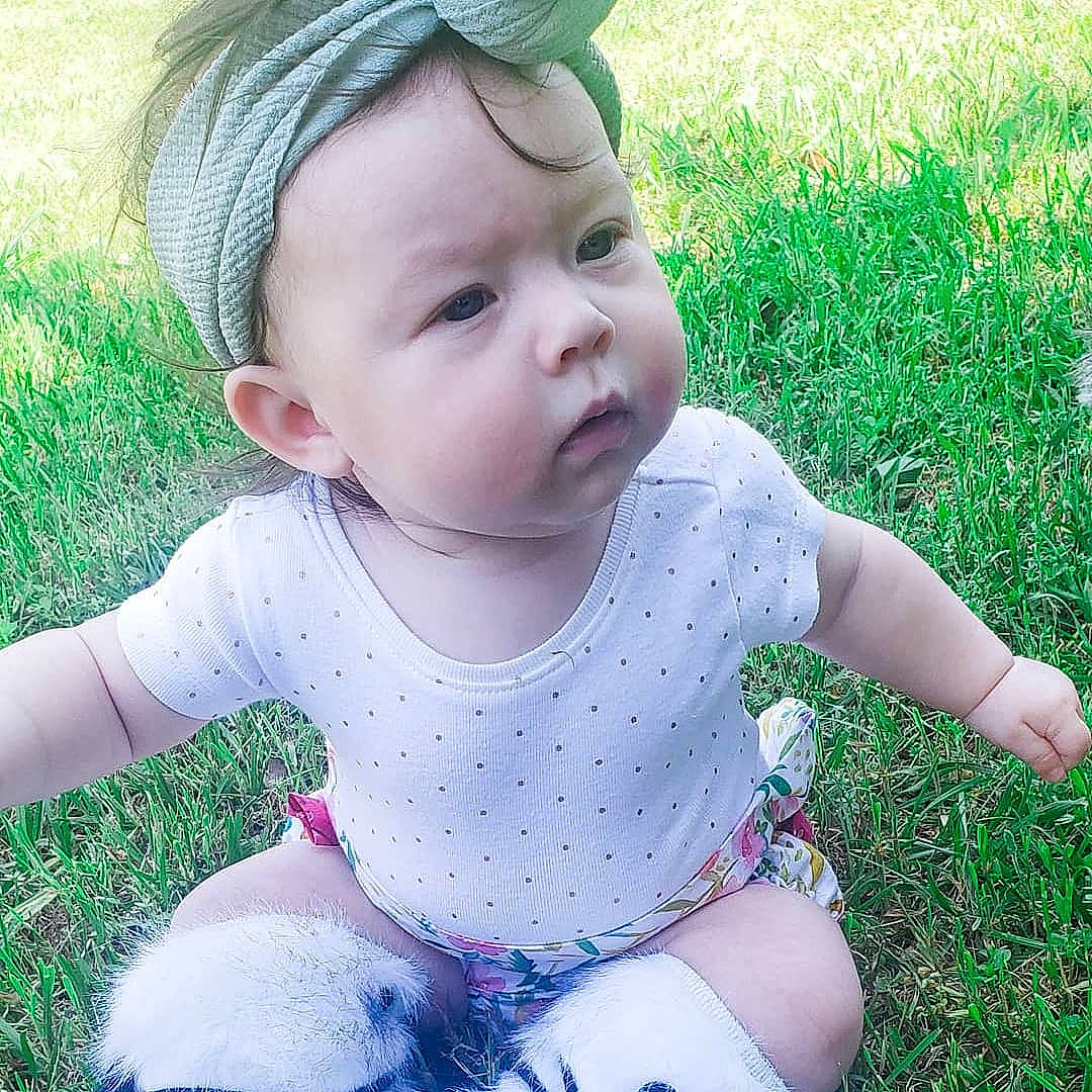 Zhavia is registered to the contest to win money with this photo: baby, baby_toddler_clothing, beauty, cheek, child, design, eye, face, grass, grass_family, green, head, leaf, lip, people_in_nature, person, pink, product, skin, summer