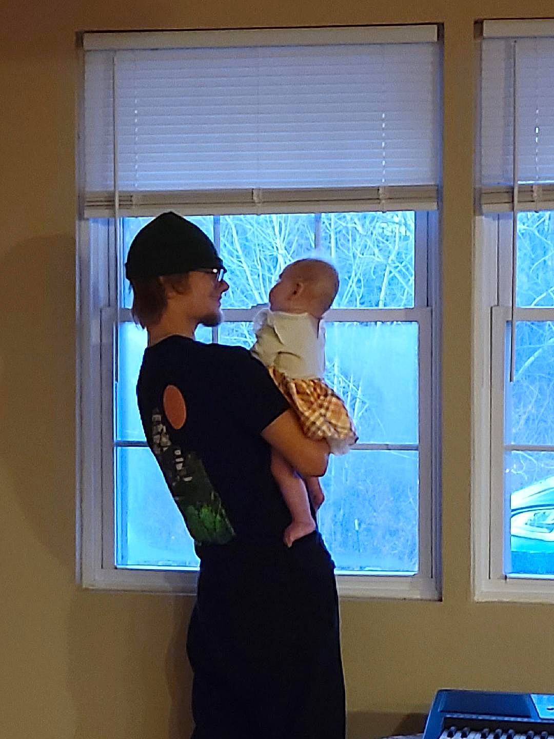 Kimberly is registered to the contest to win money with this photo: blue, conversation, elbow, electric_blue, electronic_musical_instrument, event, fun, gesture, glass, hat, headwear, joint, musical_instrument, musical_keyboard, person, room, shoulder, sitting, sun_hat, t_shirt