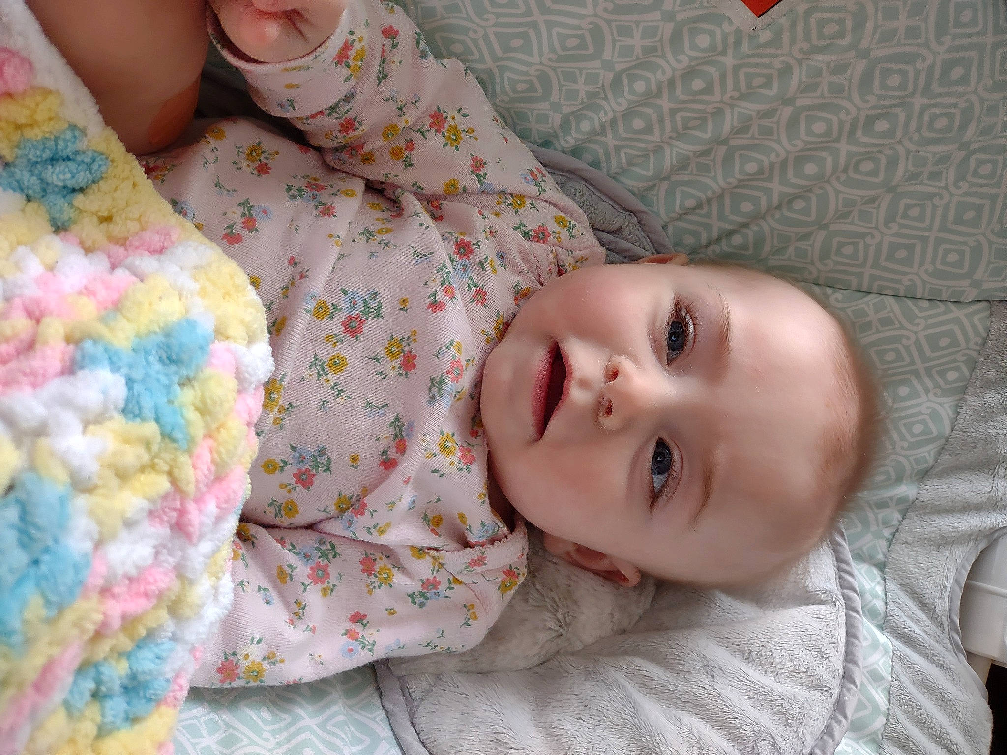 Kimmie is registered to the contest to win money with this photo: baby, baby_toddler_clothing, cheek, child, comfort, design, eye, face, head, iris, linens, lip, nose, pattern, person, pink, room, skin, sleeve, smile