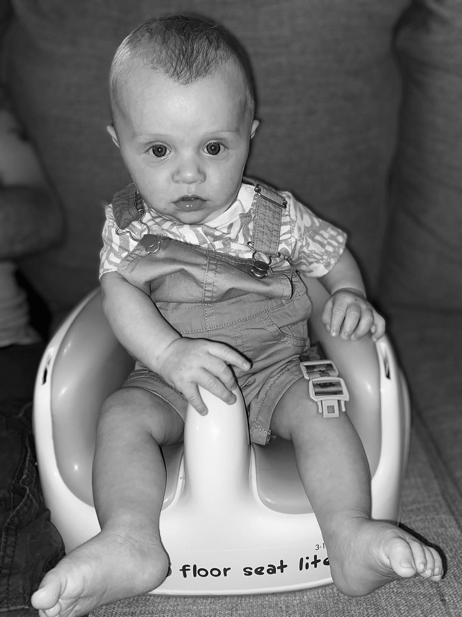 Jaxton is registered to the contest to win money with this photo: arm, baby, baby_toddler_clothing, cheek, comfort, elbow, eye, flash_photography, hand, happy, head, human_body, iris, knee, lap, leg, person, skin, style, thigh