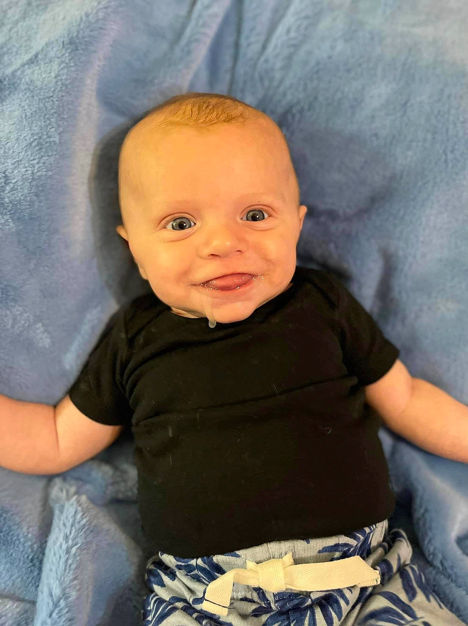 Jaxton is registered to the contest to win money with this photo: azure, baby, baby_toddler_clothing, cheek, chin, comfort, cool, eye, finger, flash_photography, happy, human_body, iris, joy, lip, mouth, nose, person, skin, sleeve