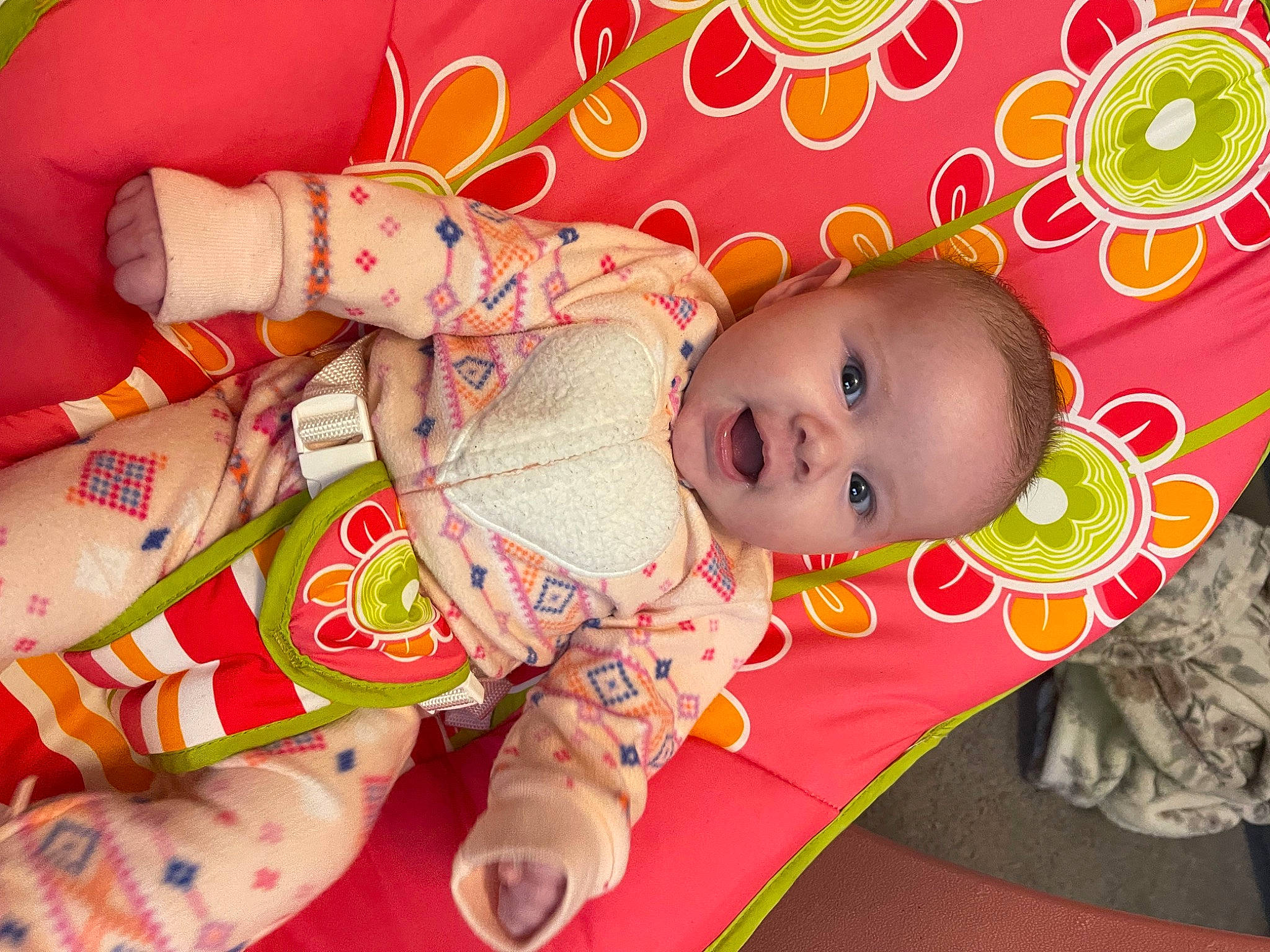 Scarlett is registered to the contest to win money with this photo: baby, baby_products, baby_toddler_clothing, baby_toys, cheek, child, foot, happy, head, human_leg, linens, nail, pattern, person, pink, product, red, room, skin, textile