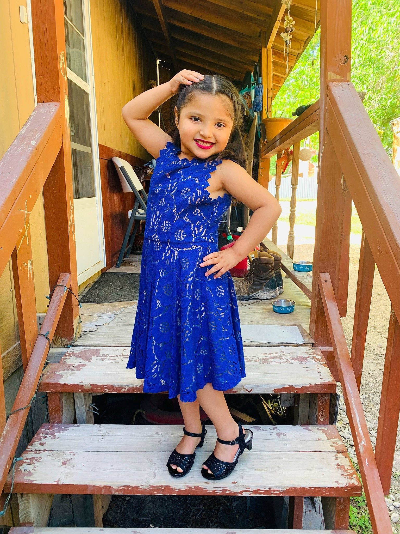 Maritza is registered to the contest to win money with this photo: child, day_dress, dress, electric_blue, fashion_design, formal_wear, fun, happy, human_leg, joy, leg, leisure, one_piece_garment, person, sandal, smile, stairs, standing, street_fashion, thigh