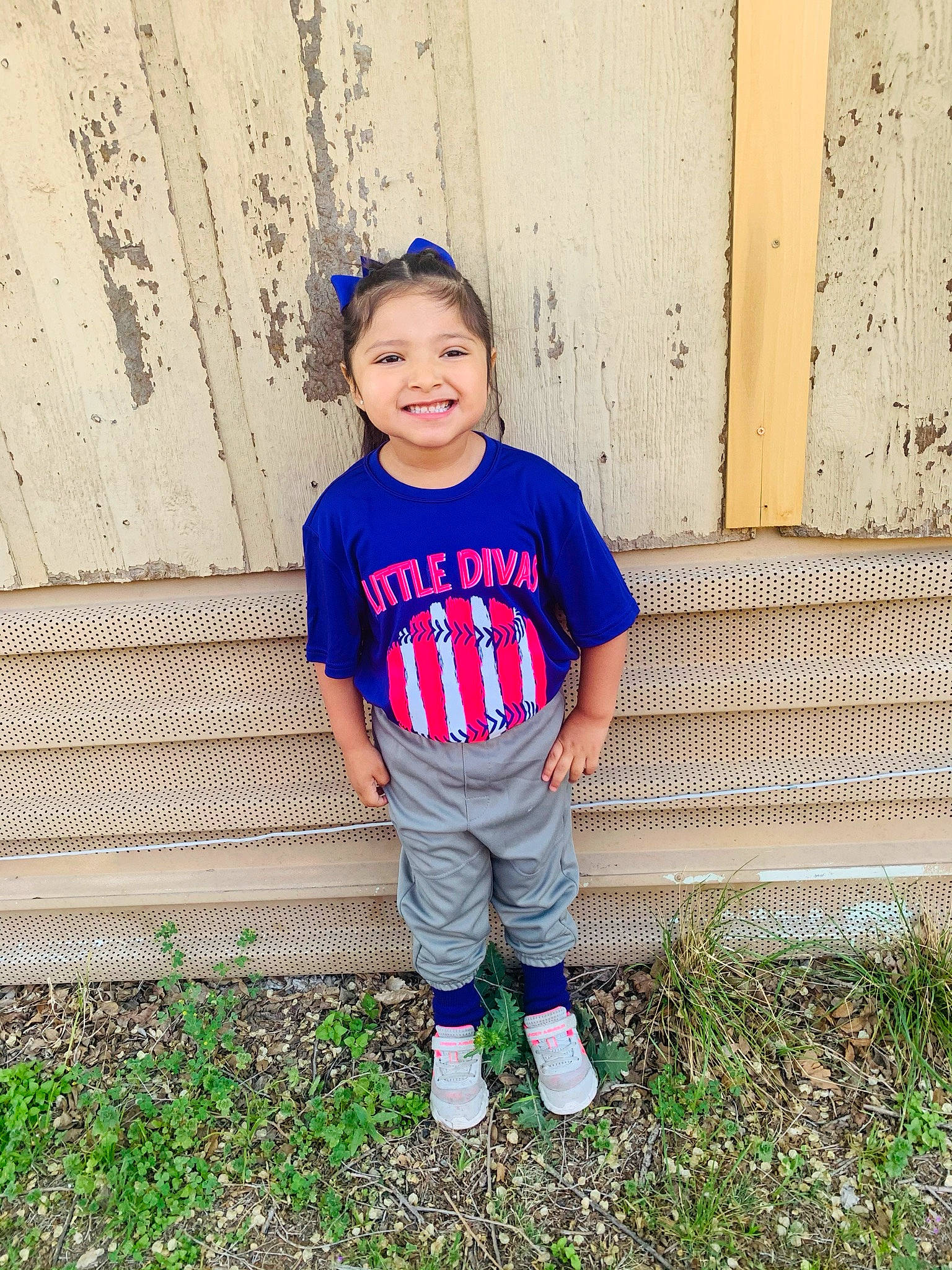 Maritza is registered to the contest to win money with this photo: baby_toddler_clothing, child, clothing, denim, electric_blue, face, footwear, fun, grass, happy, joy, knee, magenta, outerwear, pattern, person, sleeve, street_fashion, t_shirt, thigh