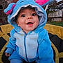 baby, child, costume, blue, pink, hood, smile, outdoor, trampoline, socks, grass, tree, evening, expression, cute, happy, person, clothing, fun, play