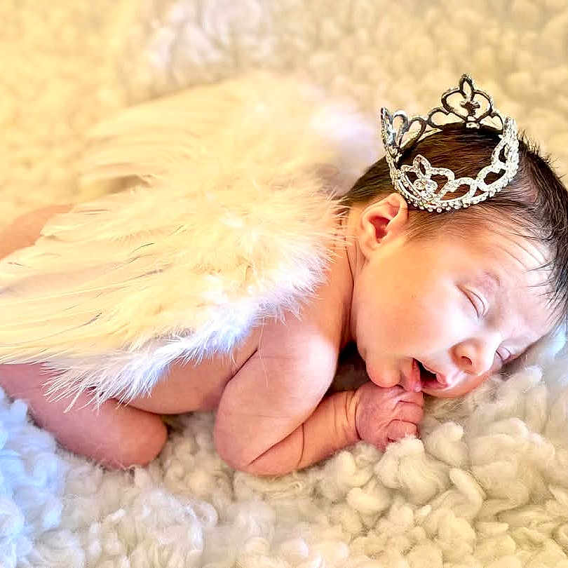 Raelynn is registered to the contest to win money with this photo: accessories, angel, baby, bathing, blanket, crown, cushion, face, head, homedecor, jewelry, newborn, person, photography, pillow, portrait, sleeping, tiara, yawning