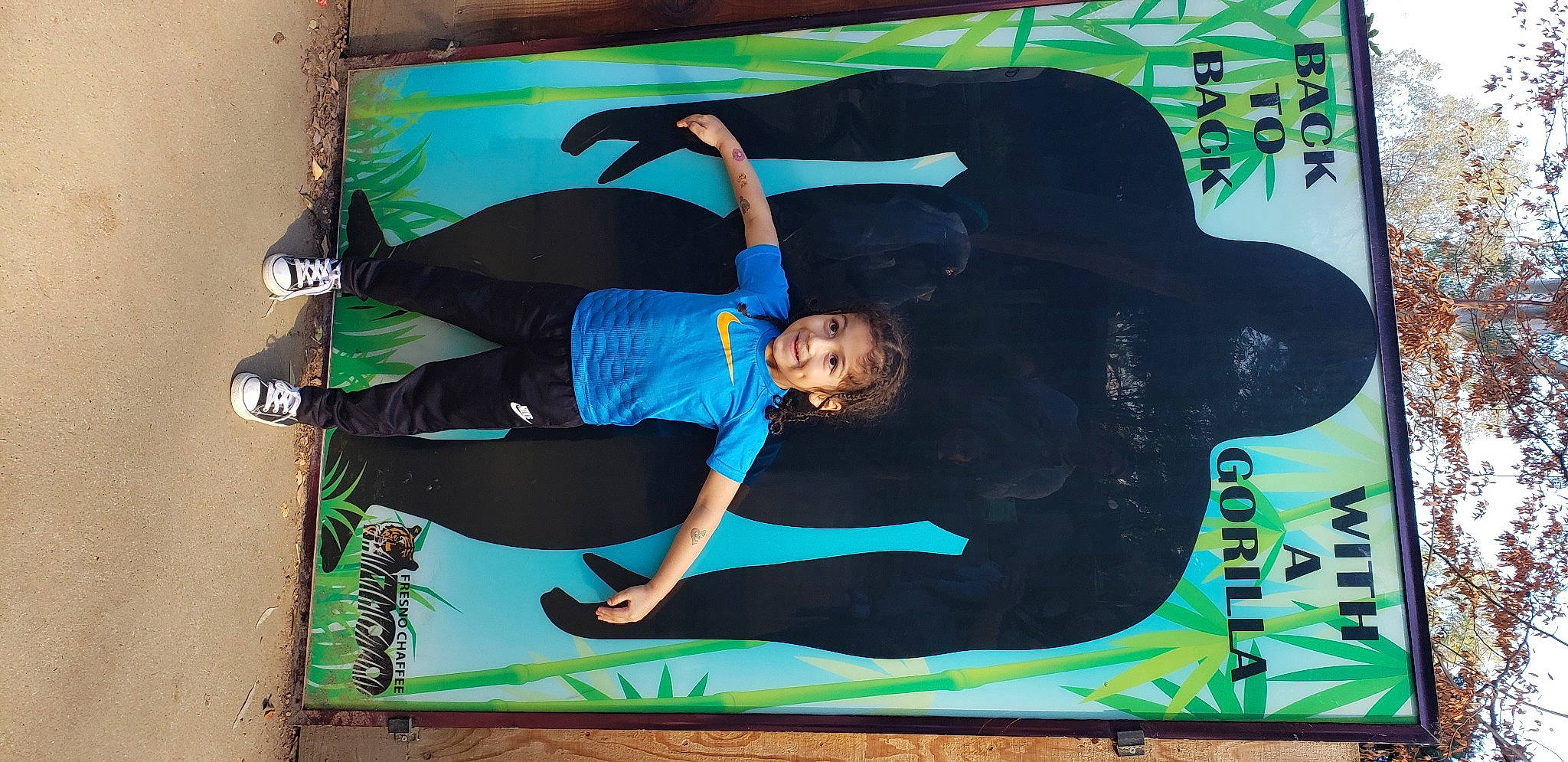 Deshawn is registered to the contest to win money with this photo: art, fictional_character, green, joy, person, street_art, style, tree