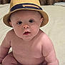 baby, blanket, blue_eyes, child, chubby, closeup, curious, cute, expression, face, hat, headwear, indoor, infant, person, portrait, sitting, skin, soft_lighting, young
