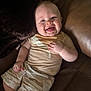 baby, child, smiling, couch, leather, clothing, shorts, tshirt, happy, drool, skin, person, indoor, infant, relaxing, seat, portrait, cute, young, casual