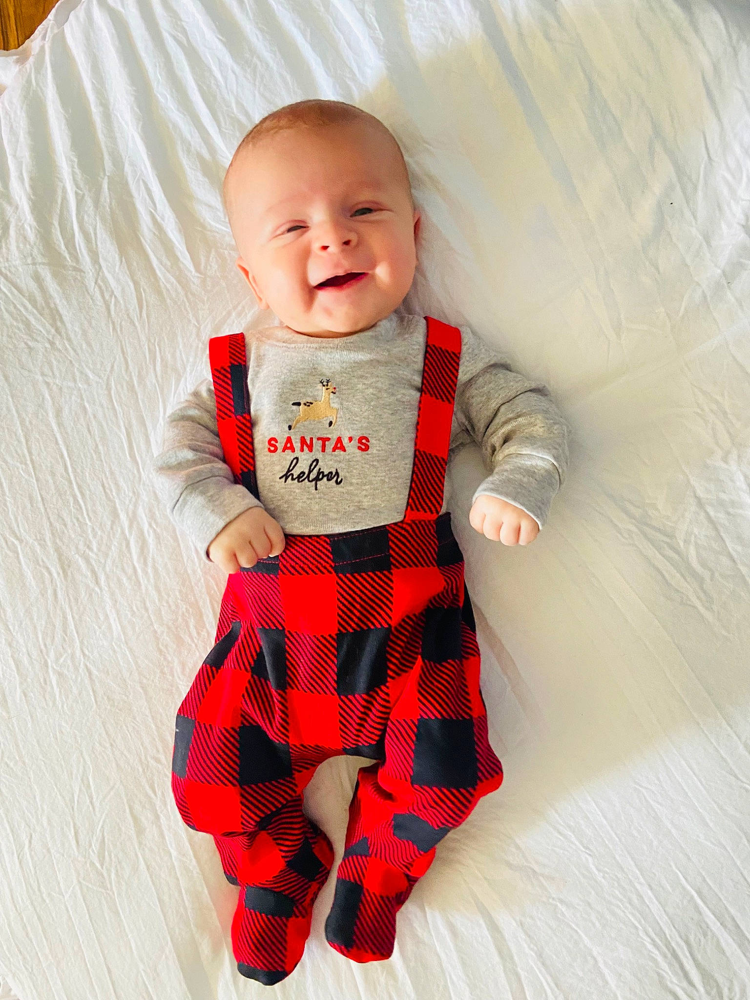 Jaxen is registered to the contest to win money with this photo: arm, baby, baby_toddler_clothing, collar, comfort, eye, happy, head, human_body, mammal, orange, outerwear, person, product, sleeve, smile, t_shirt, textile, toddler, toy
