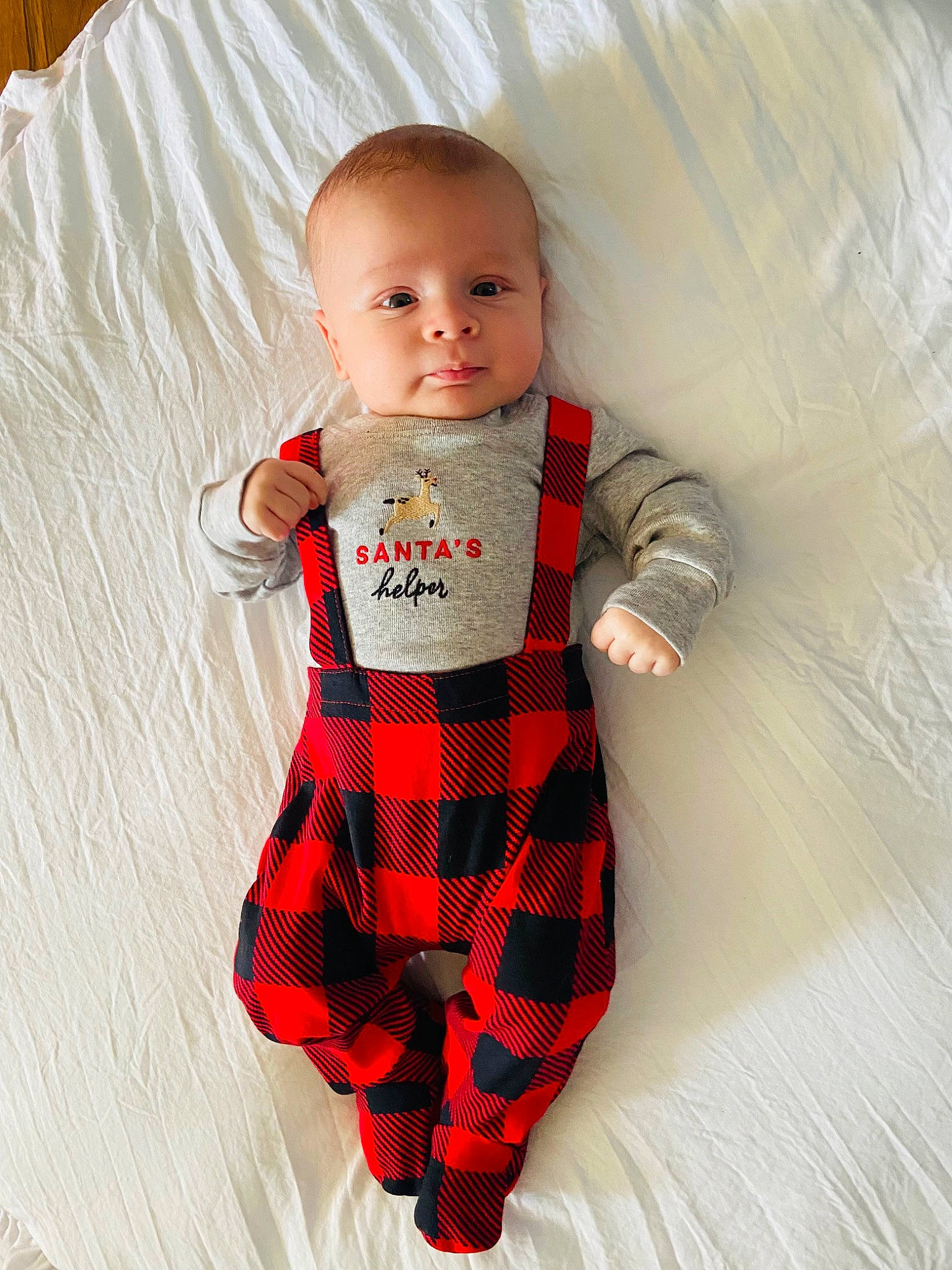 Jaxen is registered to the contest to win money with this photo: abdomen, arm, baby, baby_toddler_clothing, collar, comfort, head, human_body, neck, outerwear, person, plaid, product, sleeve, t_shirt, tartan, textile, thigh, toddler, trunk
