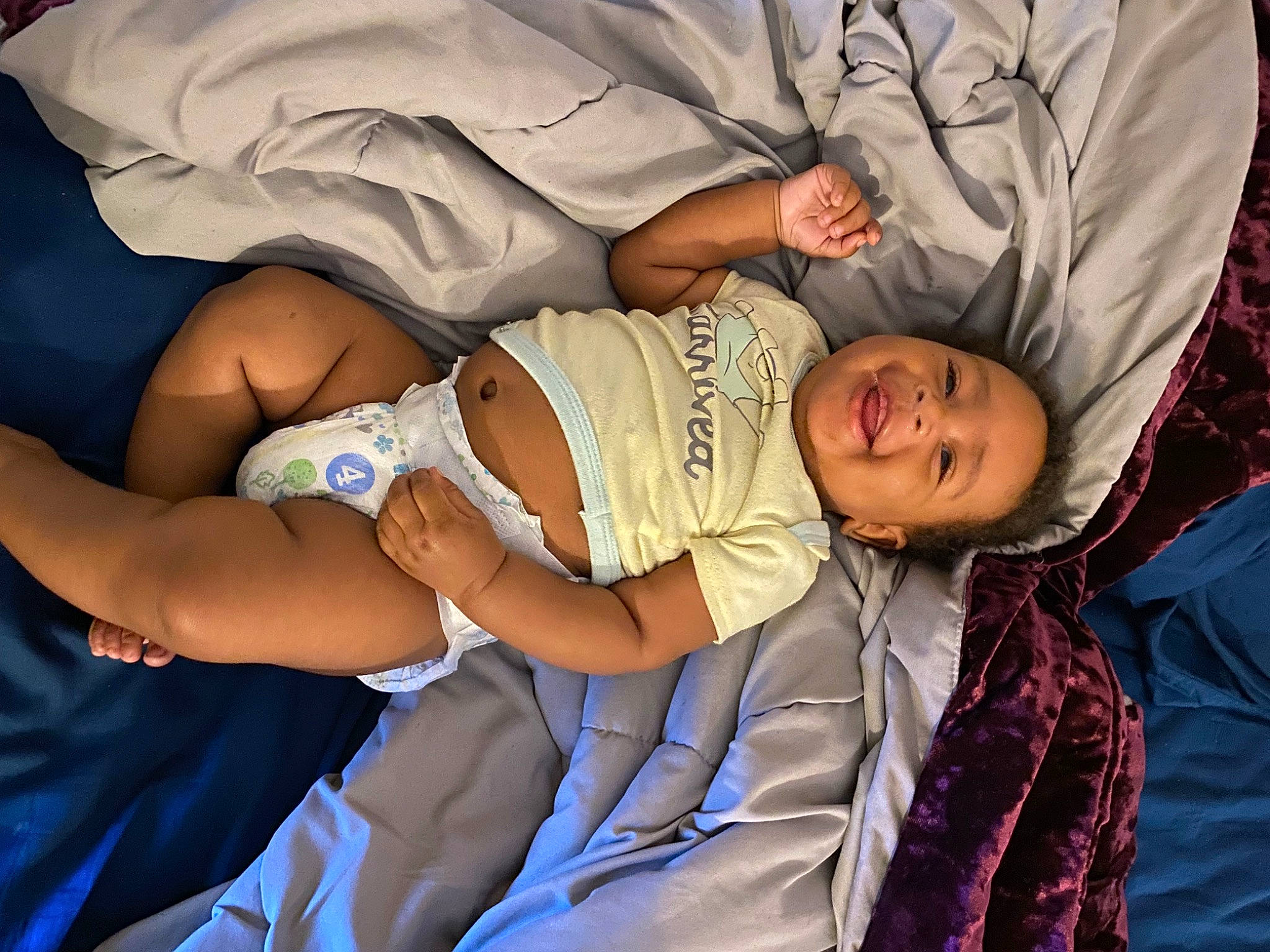 Iniko is registered to the contest to win money with this photo: abdomen, baby, baby_products, baby_sleeping, baby_toddler_clothing, child, comfort, elbow, event, fun, gesture, hand, happy, human_body, human_leg, mouth, person, smile, thigh, toddler