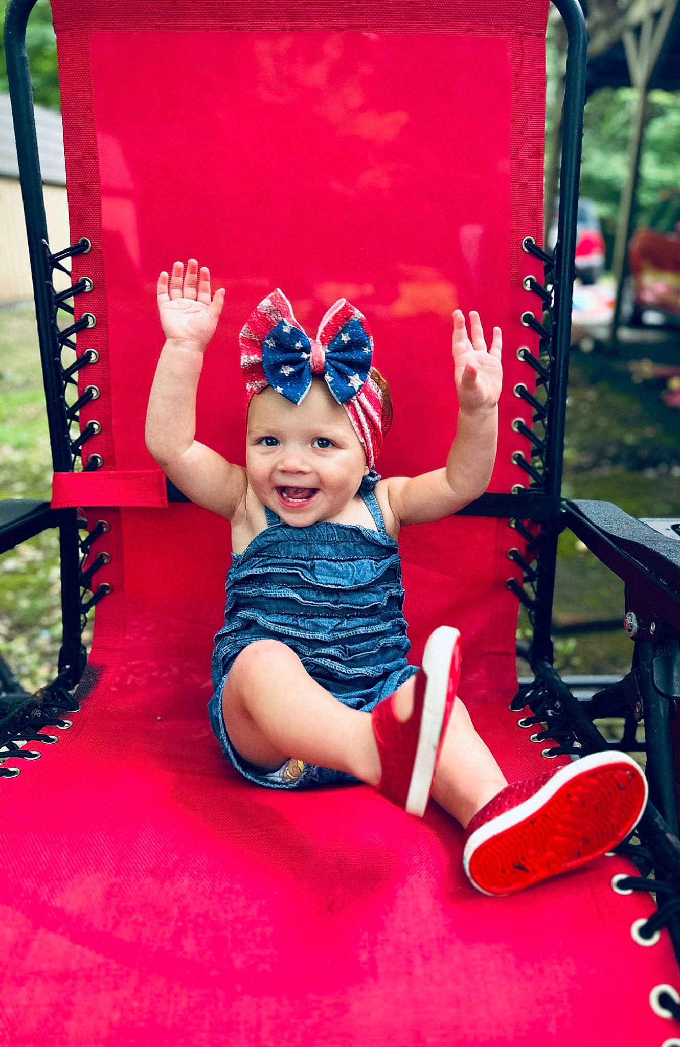 Presleigh is registered to the contest to win money with this photo: child, electric_blue, entertainment, foot, fun, grass, happy, headwear, human_leg, joy, leisure, magenta, person, pink, purple, recreation, red, sandal, shoe, sitting