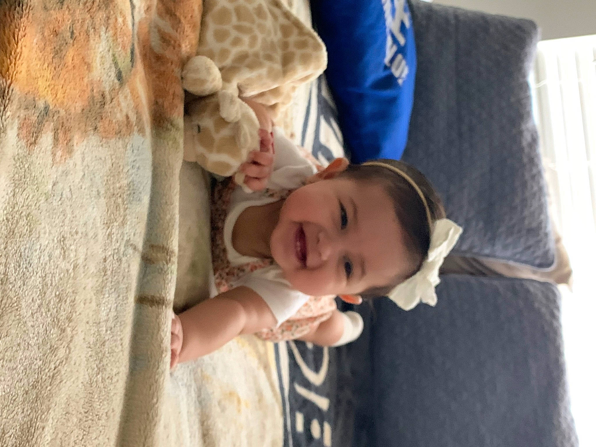 Adelyn joined the competition — help win amazing prizes! arm, baby, comfort, dress, eye, face, happy, hat, head, human_body, joy, nose, person, plant, sitting, skin, smile, sun_hat, toddler, tree