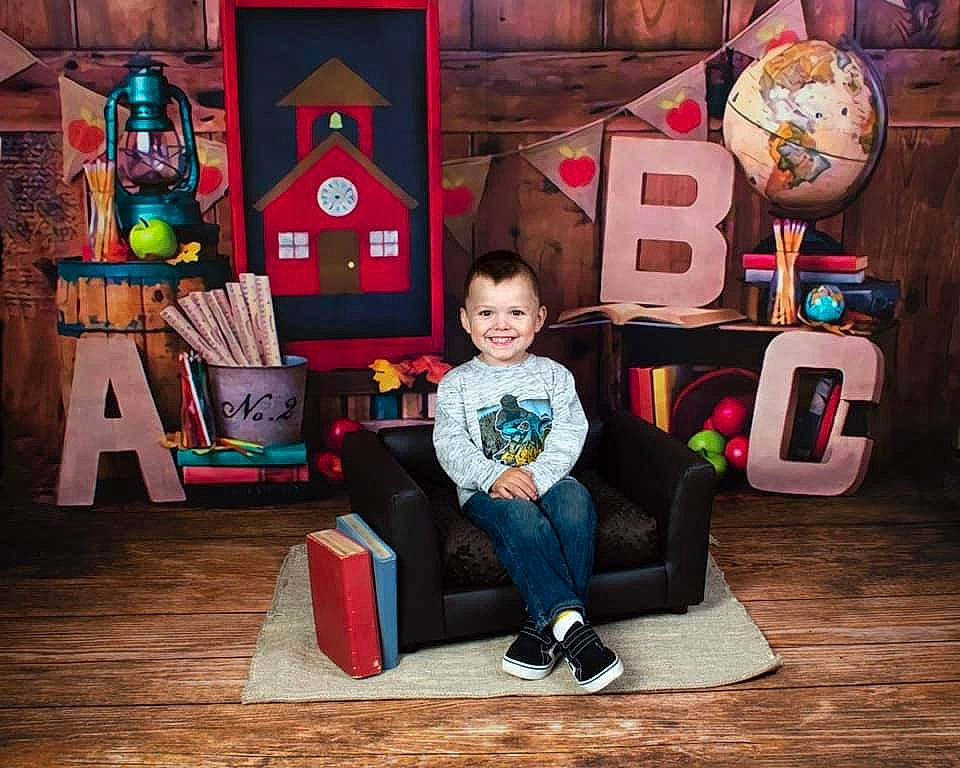 Brantlei is registered to the contest to win money with this photo: animation, art, child, door, entertainment, event, flooring, fun, happy, interior_design, joy, leisure, person, play, recreation_room, room, sitting, smile, t_shirt, toddler