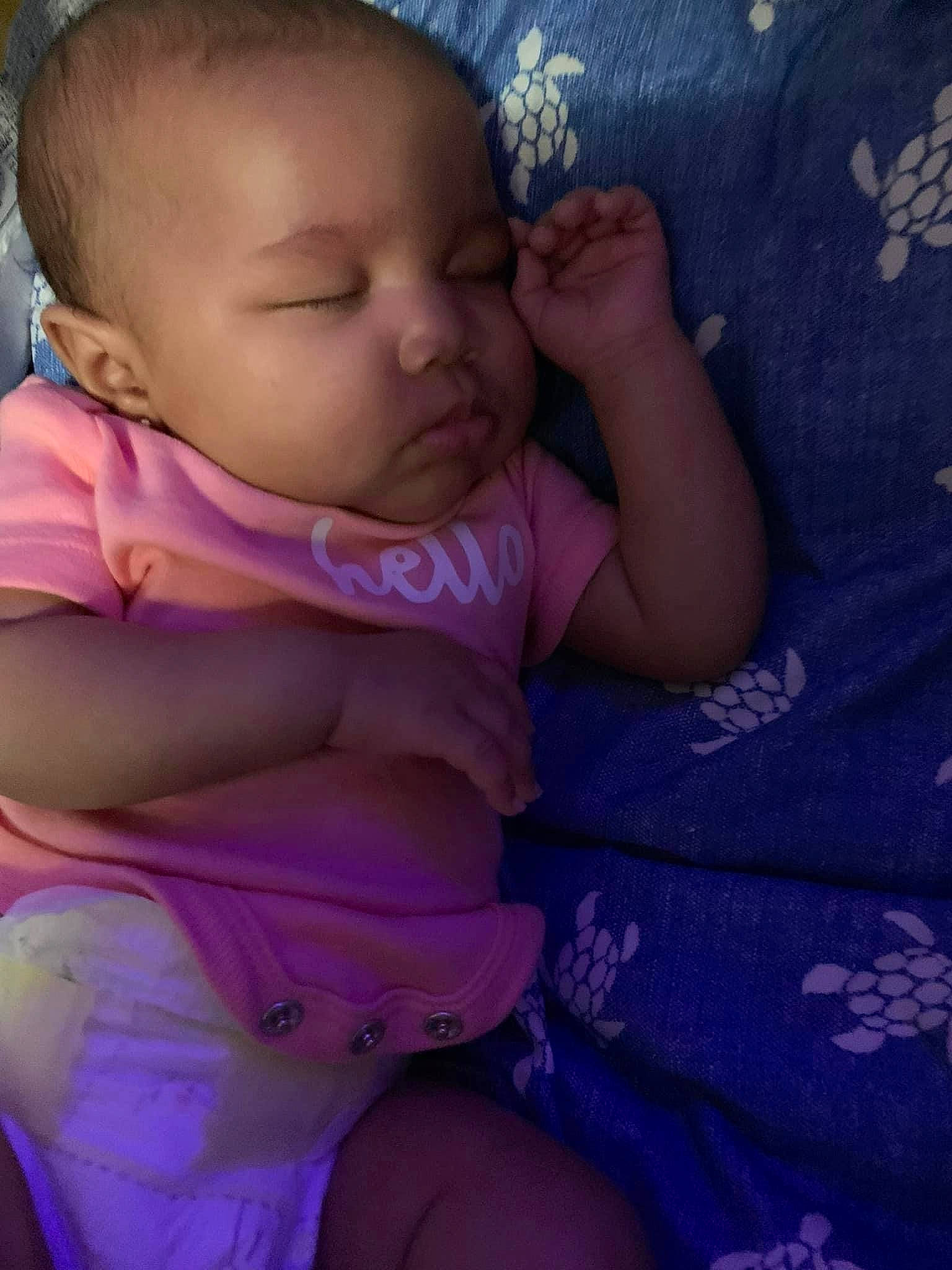 Malaysia is registered to the contest to win money with this photo: baby, baby_toddler_clothing, cheek, comfort, finger, gesture, hand, happy, iris, lip, magenta, mouth, nose, person, pink, purple, skin, textile, thumb, toddler