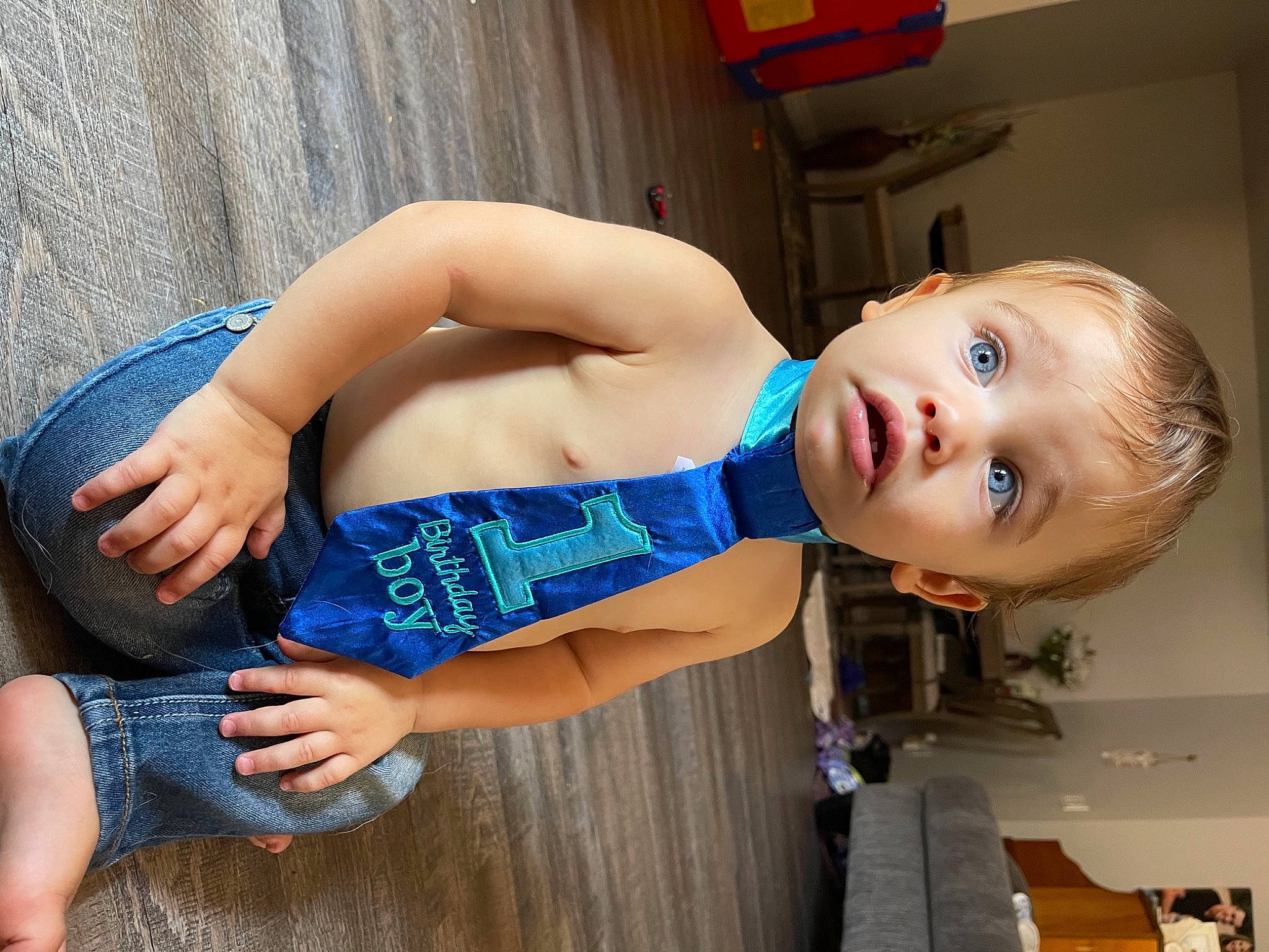 Emry is registered to the contest to win money with this photo: blue, chest, denim, elbow, electric_blue, foot, fun, happy, head, human_leg, joint, knee, leisure, person, shorts, surprise, thigh, toddler, trunk, waist
