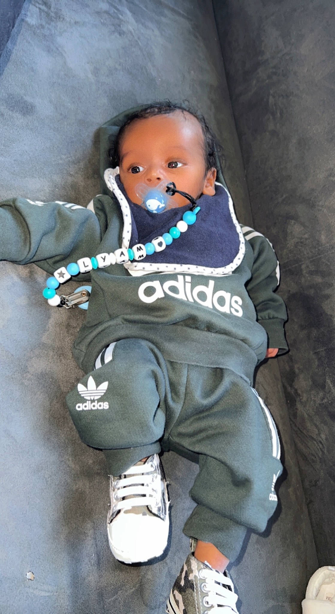 Lyam participe au concours pour gagner de l'argent avec cette photo : baby, baby_toddler_clothing, cheek, child, electric_blue, flash_photography, fun, happy, person, personal_protective_equipment, sitting, sleeve, smile, sportswear, t_shirt, toddler, vacation, walking_shoe