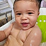 Jaxon is registered to the contest to win money with this photo: baby, child, bathtub, wet_skin, smiling, happy, hair, mohawk, bath_time, infant, cute, water, sitting, green, white, indoors, face, portrait, skin, person
