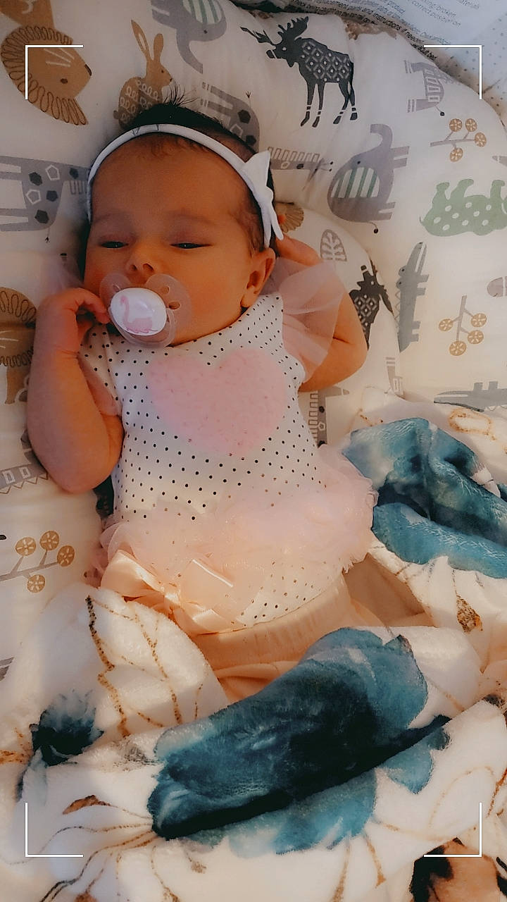 Amora joined the competition — help win amazing prizes! art, baby, baby_products, baby_safety, baby_toddler_clothing, cap, chest, child, comfort, fashion_accessory, pattern, person, sitting, skin, sun_hat, toddler, white