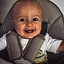 accessories, baby, babylaughing, bodypart, clothing, coat, cushion, face, happy, head, homedecor, jacket, laughing, mouth, person, photography, portrait, smile, teeth, vest