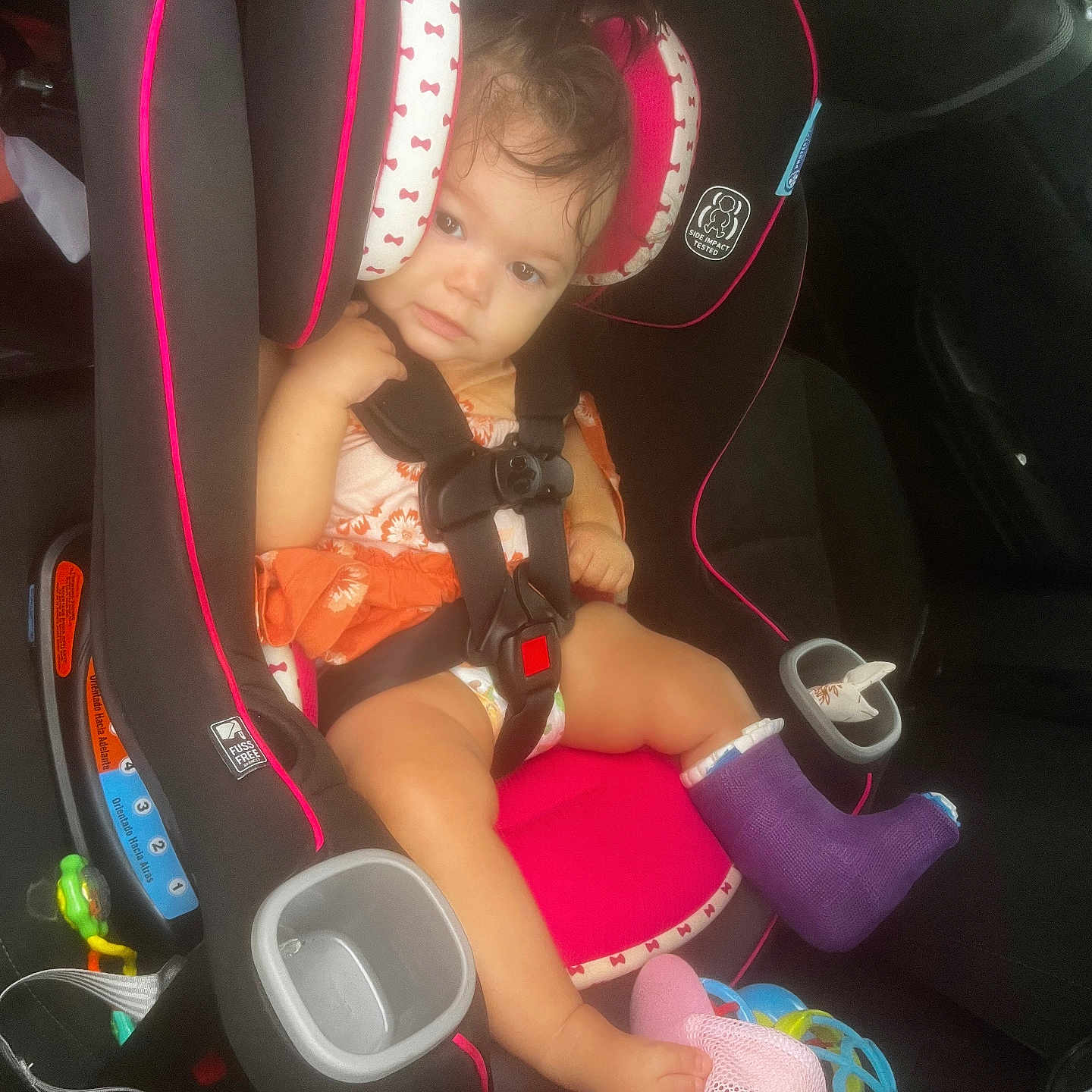 Sophia is registered to the contest to win money with this photo: accessories, baby, car, car_interior, carseat, clothing, cushion, face, footwear, head, homedecor, hosiery, person, photography, portrait, shoe, shorts, sock, transportation, vehicle