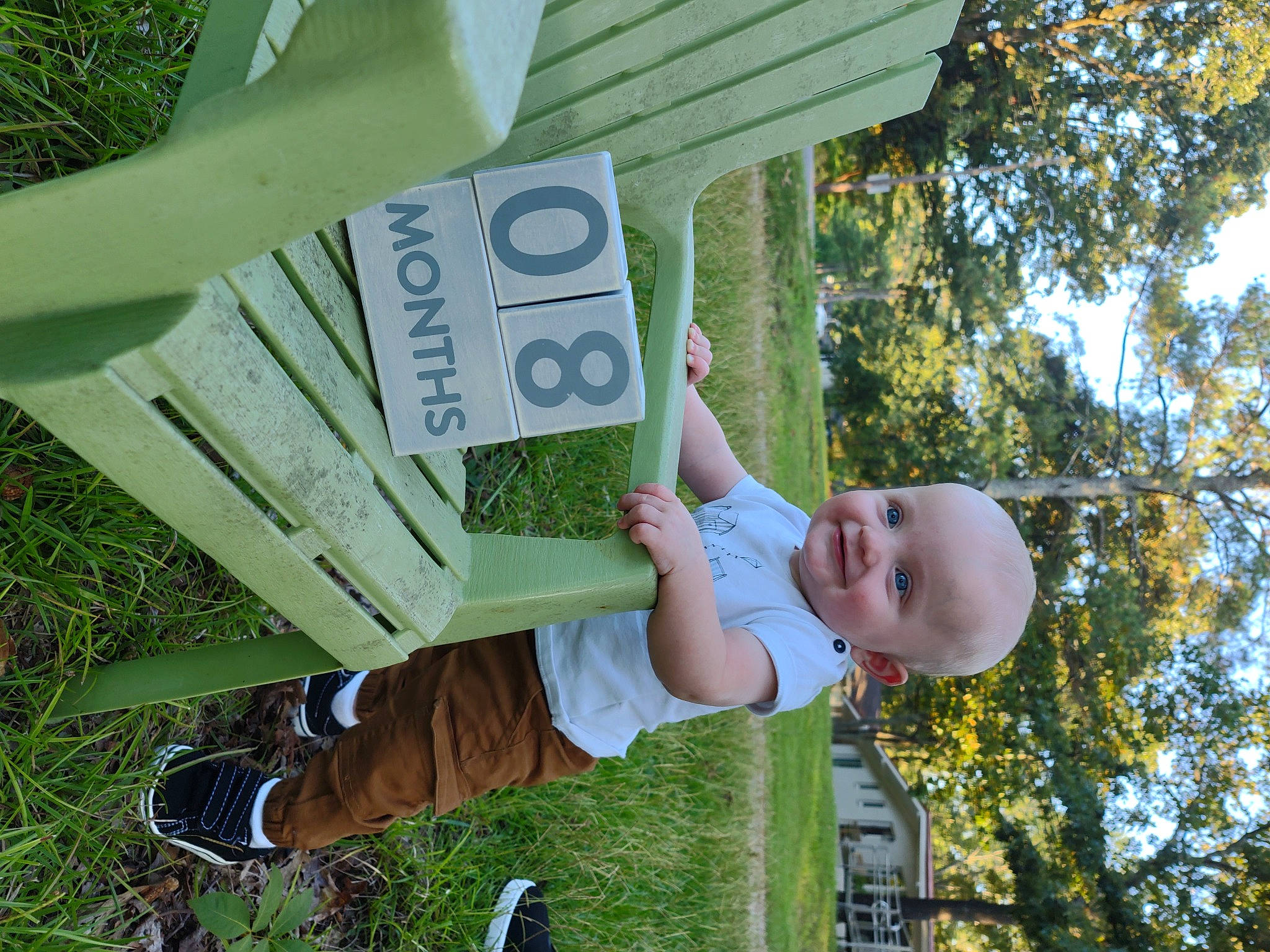 Jeremy is registered to the contest to win money with this photo: baby, child, city, fun, garden, grass, happy, joy, leaf, leisure, outdoor_play_equipment, people_in_nature, person, plant, shade, smile, spring, t_shirt, toddler, tree