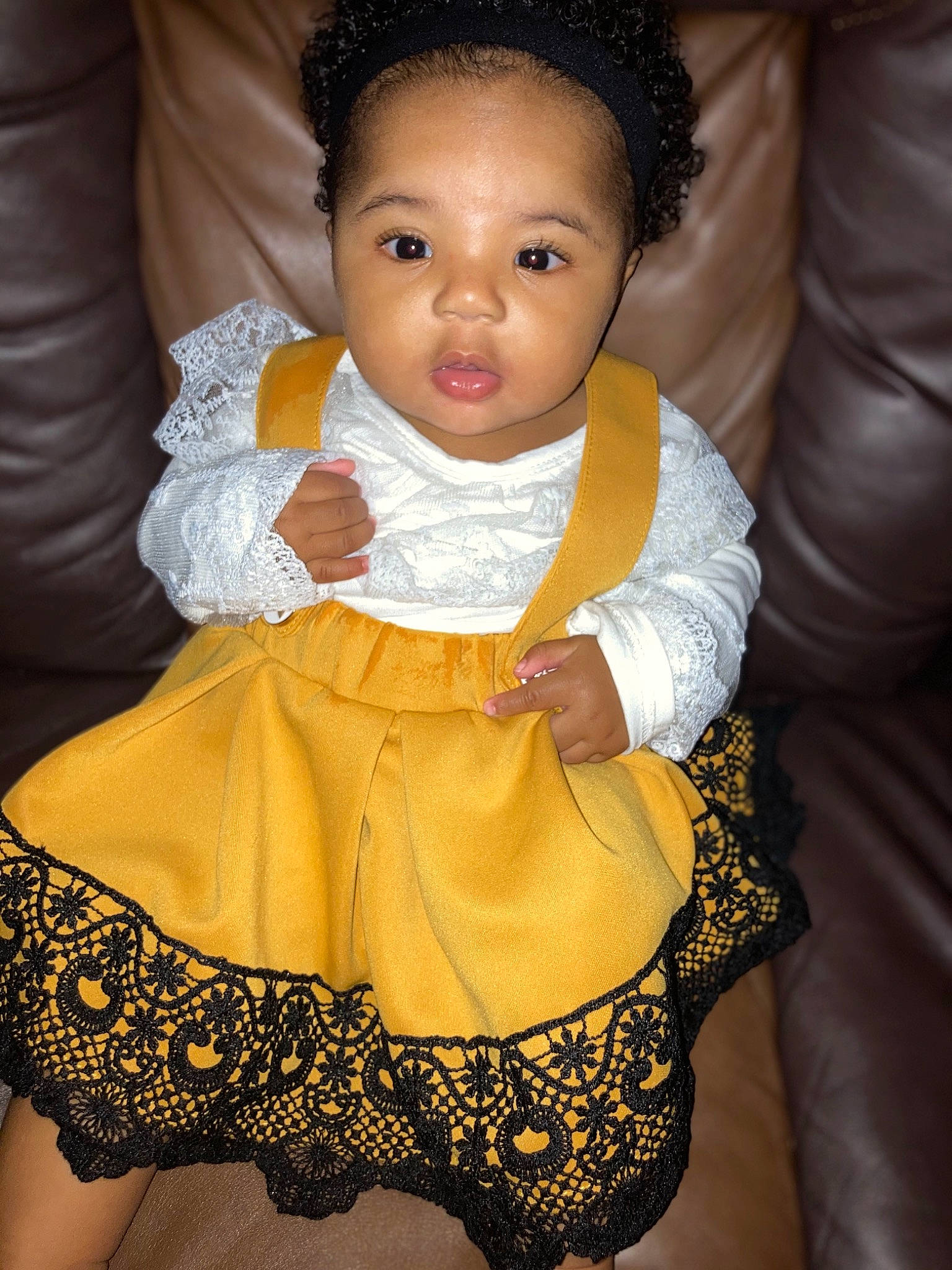 Symphony joined the competition — help win amazing prizes! baby, black_hair, cheek, child, child_model, dress, eye, formal_wear, head, iris, lace, person, sitting, skin, textile, toddler, yellow