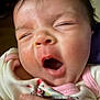 Lily is registered to the contest to win money with this photo: baby, yawning, close_up, infant, sleepy, face, skin, hand, clothing, cute, mouth_open, expression, newborn, person, indoors, soft_lighting, pink, white, child, adorable