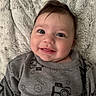Silas joined the competition — help win amazing prizes! baby, blanket, camera_print, child, cozy, cute, eyes, face, grey_clothing, happy, indoors, infant, lying_down, pattern, portrait, smile, smiley_face, soft_texture, sweater, young