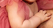 Ava is registered to the contest to win money with this photo: arm, baby, child, clothing, cute, dress, eyes, fabric, face, green_bow, hair, hand, indoor, person, pink, portrait, skin, smile, toddler, young