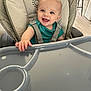 Archie joined the competition — help win amazing prizes! baby, high_chair, smiling, blue_eyes, child, indoor, plastic_tray, clothing, seatbelt, happy, infant, person, furniture, hand, cheerful, cute, toddler, face, expression, light