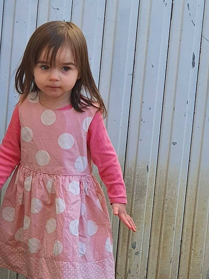 Judy participe au concours pour gagner de l'argent avec cette photo : baby_toddler_clothing, day_dress, dress, eyelash, fashion_design, formal_wear, lip, long_hair, magenta, one_piece_garment, outerwear, pattern, person, pink, shoulder, skin, sleeve, street_fashion, toddler, waist