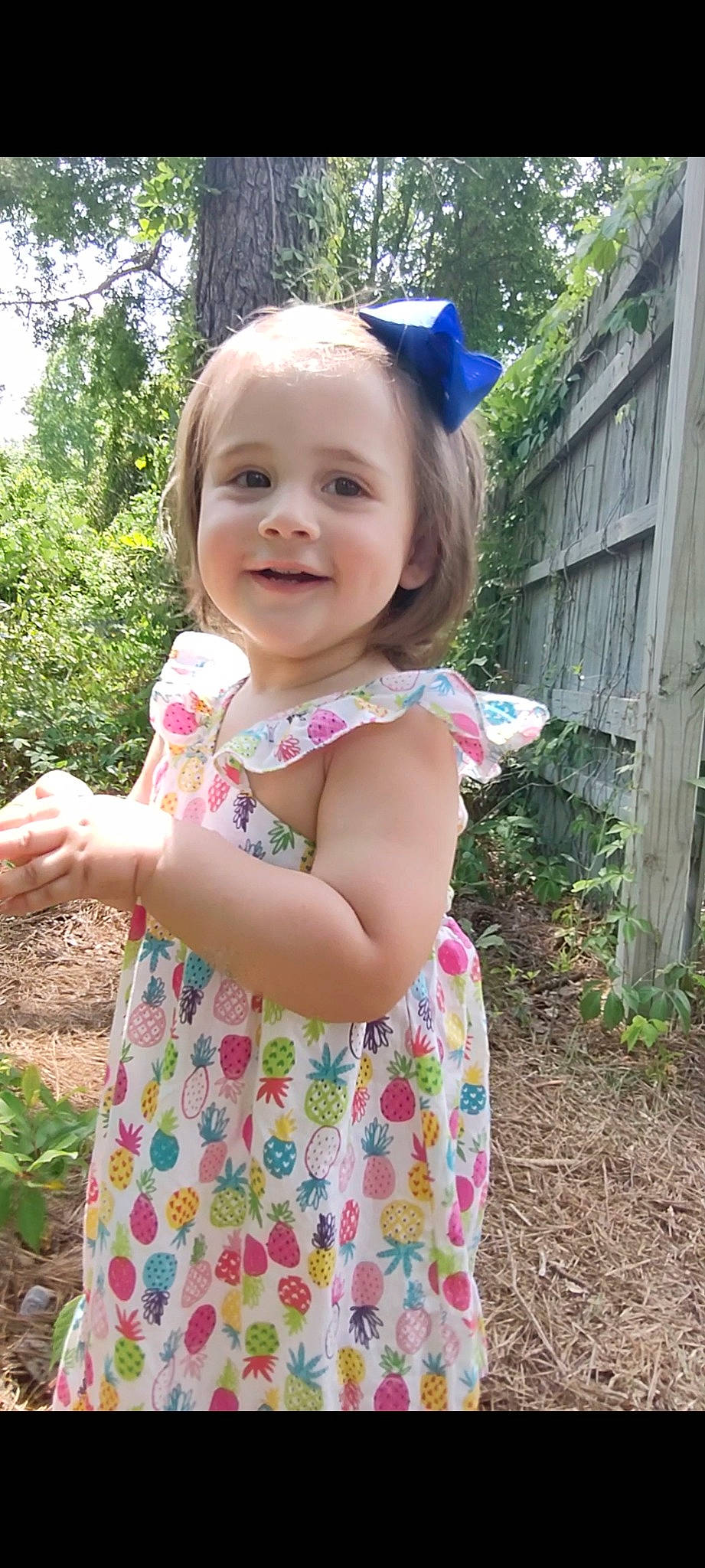 Belle is registered to the contest to win money with this photo: baby_toddler_clothing, clothing, dress, eye, face, facial_expression, gesture, hair, hairstyle, hand, happy, head, human_body, iris, joy, people_in_nature, person, plant, skin, sleeve