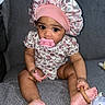 Malani is registered to the contest to win money with this photo: adorable, baby, bonnet, child, couch, face, feet, floral_outfit, gray_couch, hands, home, indoor, infant, pacifier, pink_bonnet, portrait, sitting, soft_lighting, stuffed_toy, wide_eyes