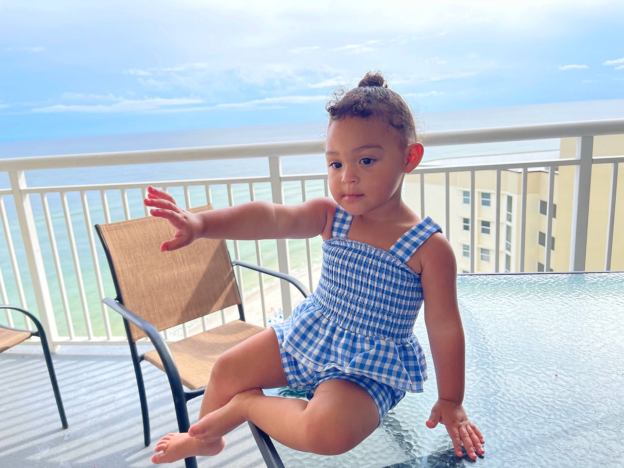 Amessia Klaire is registered to the contest to win money with this photo: azure, baby_toddler_clothing, barefoot, chair, cloud, electric_blue, foot, fun, happy, human_leg, knee, leisure, outdoor_furniture, person, shoulder, sitting, sky, thigh, toddler, travel